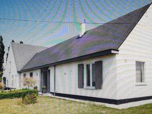 a white house with a black roof at Beautiful rooms at countryside Brussels in Halle