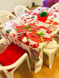 a table with a christmas table cloth on top of it at B&B Il più bello in San Salvo