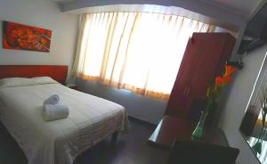 Cama ou camas em um quarto em Hotel Sumaq Inn Sac