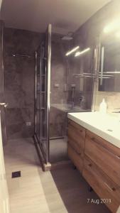 a bathroom with a shower and a sink at West Beach Apartment in Durrës +38 photos