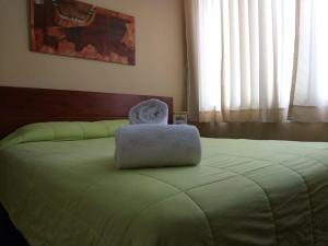 Cama ou camas em um quarto em Hotel Sumaq Inn Sac mais 7 fotos