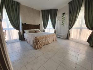 Katil atau katil-katil dalam bilik di B&B città del carrubo