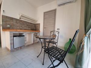 Kuchyň nebo kuchyňský kout v ubytování B&B città del carrubo + 34 fotografií