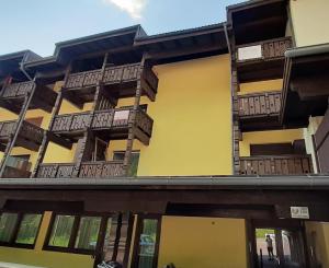 an apartment building with balconies on the side at Appartamento Pampeago 10 in Tesero