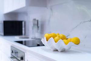 a bowl of fruit on a counter in a kitchen at Mullins Grove in Saint Peter