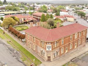 an overhead view of a large brick building on a street at Central Springs Inn in Daylesford