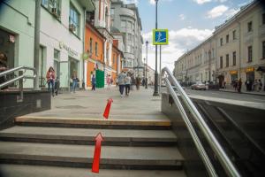 a street with orange cones on the stairs in a city at Hostel 5Nebo in Moscow