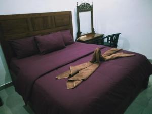 
Ein Bett oder Betten in einem Zimmer der Unterkunft Belongs Beach Bungalow
