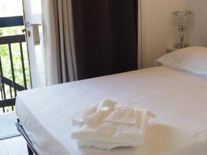 Łóżko lub łóżka w pokoju w obiekcie Casa Vacanze Bungalow I Girasoli