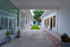 A garden outside MRD Beach Hotel