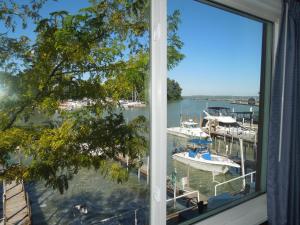 a view through a window of a boat docked in the water at Arlington Inn in Port Clinton