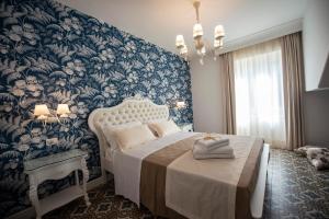 Voodi või voodid majutusasutuse Sui Generis Tropea Luxury Rooms toas