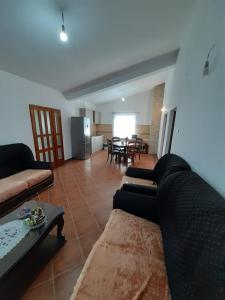a living room with a couch and a table at Apartments Mirovica in Bar