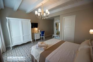 Voodi või voodid majutusasutuse Sui Generis Tropea Luxury Rooms toas