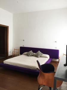 מיטה או מיטות בחדר ב-Uma Apartments