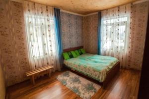 En eller flere senger på et rom på Guesthouse Tanano/Dodo