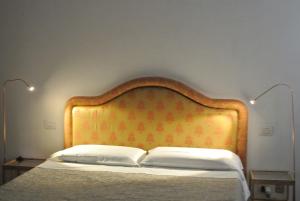 Postel nebo postele na pokoji v ubytování Uma Apartments