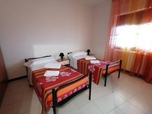 Posteľ alebo postele v izbe v ubytovaní Bed and breakfast lagiocosa