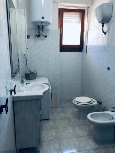 Koupelna v ubytování CIMAROSA ROOM AFFITTI BREVI + 32 fotografií