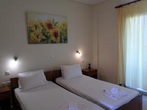Ένα ή περισσότερα κρεβάτια σε δωμάτιο στο Asfodelos Apartment Hotel