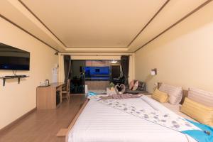 a bedroom with a large bed in a room at La Luna Italian Restaurant & Accommodation in Ko Lipe