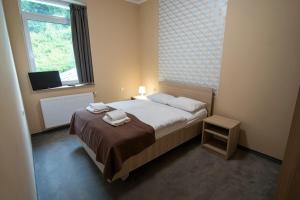 Posteľ alebo postele v izbe v ubytovaní 4family *RESORT*SPA*