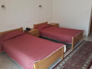 A bed or beds in a room at Hotel Kastro