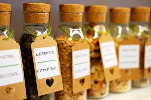 a row of jars filled with different types of food at Hotel Erika in Malcesine