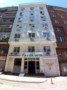 a large white building with a sign on it at BURSA ŞAHiN HOTEL in Bursa