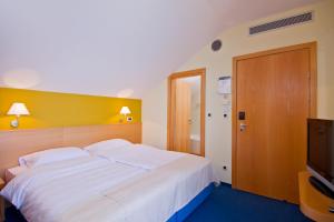 Letto o letti in una camera di Hotel Saudade