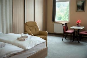 Posteľ alebo postele v izbe v ubytovaní 4family *RESORT*SPA*