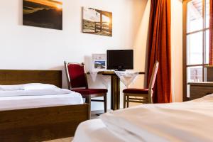 Letto o letti in una camera di Hotel Weisses Lamm