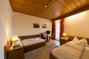 Letto o letti in una camera di Hotel Weisses Lamm