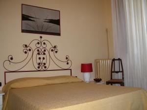 Кровать или кровати в номере Villa Patrizia B&B