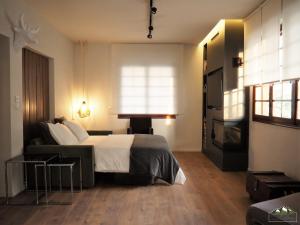 A bed or beds in a room at Fort D-Val luxurious apartment