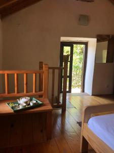 a bedroom with a table and a bed and a door at Holiday home Villa Kastel in Korčula