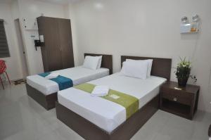 Letto o letti in una camera di RNR Suites