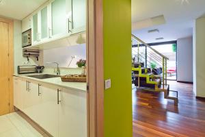 A kitchen or kitchenette at My Space Barcelona Pool Garden Apartments