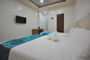Letto o letti in una camera di RNR Suites