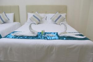 Letto o letti in una camera di RNR Suites