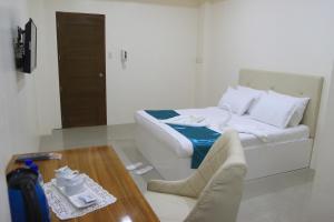 Letto o letti in una camera di RNR Suites