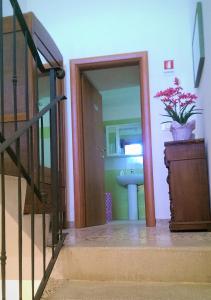a bathroom with a sink and a potted plant at Il Mandorlo in Ficulle +21 photos
