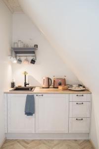Kuchyň nebo kuchyňský kout v ubytování KaksTeist Apartments