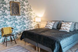 Postel nebo postele na pokoji v ubytování KaksTeist Apartments