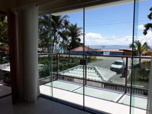 a view of the ocean from the balcony of a house at Areia do Atlantico Hotel in Porto Seguro