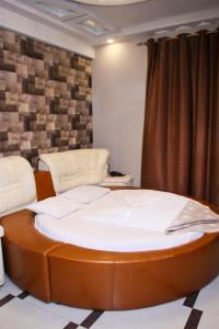 Voodi või voodid majutusasutuse GOLDEN SECONDS Hotel toas