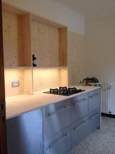 a kitchen with a stove and a counter top at vakantiehuis met hottub en zicht op de Semois in Herbeumont