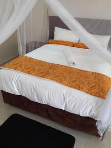 Postel nebo postele na pokoji v ubytování Delight Lodge