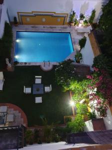 an overhead view of a swimming pool in a yard at Casa San José in Palma del Río