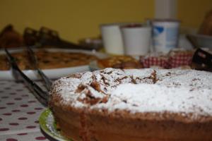 a cake on a plate on a table at Il Boschetto in Porto SantʼElpidio +54 photos